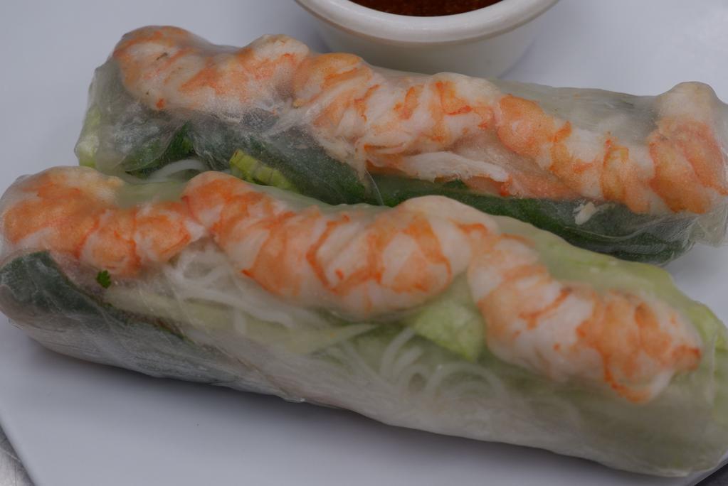 Spring Rolls (2 Pc) · Soft rice paper wrapper with vermicelli noodles, lettuce, basil, carrot; peanut sauce.
