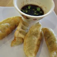 Pork Dumplings (4 Pc) · Steam or fried stuffed with cabbage, green onions, wheat dough; sweet soy dipping sauce.