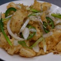 Fried Calamari · Fried tempura battered calamari stir-fried with garlic, white onions, spring onions, and sea...