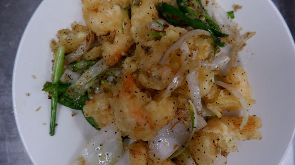 Salt & Pepper Shrimp · Fried tempura battered shrimp, then stir-fried with garlic, jalapenos, white onion, spring onion, and seasoning. Side salt and pepper lime dipping sauce.