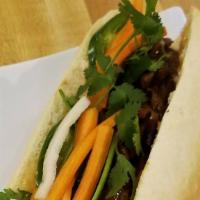 Lemongrass Banh Mi · French baguette, cilantro, cucumber, jalapeño, pickled daikon/carrot, and spicy mayo. Meat i...