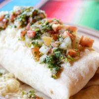 Burrito Tapatio · pork (carnitas) rice and beans all inside topped with cheese and pico de gallo