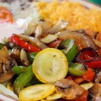 Lunch Fajita Vegetarian · Grilled onions, bell pepper, tomatoes, mushrooms. Served with 
beans, salad, guacamole, sour...
