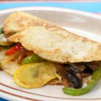 Quesadilla Vegetarian · Grilled mix vegetables inside of flour tortilla with melted cheese.