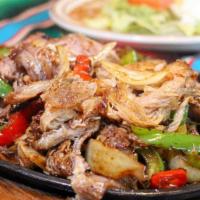 Fajitas Pork · chunks of pork with grilled onions, bell pepper, tomatoes, mushrooms. Served with beans, 
sa...