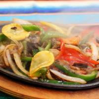 Fajitas Vegetarians · Grilled onions, bell pepper, tomatoes, mushrooms. Served with beans, salad, guacamole, sour ...