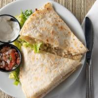 Spicy Shredded Beef Quesadilla · Served with Lettuce, Pico, Sour Cream on the side