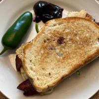 Gourmet Grilled Cheese · Swiss cheese, bacon, jalapeno with housemade mixed berry jam on grilled bread.