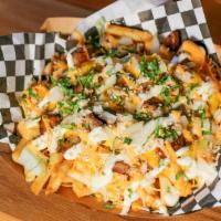 Loaded Fries · Hand-cut fries topped with giant sauce garlic aioli shredded cheese, and bacon.