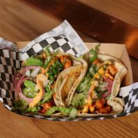 Korean Chicken Tacos  · Gochujang marinated chopped chicken thighs served with lettuce, onions, cilantro, spicy mayo...