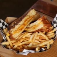 Grilled Cheese  · Cheddar, American, and Jack cheese served on toasted sourdough. Served with fries, or substi...