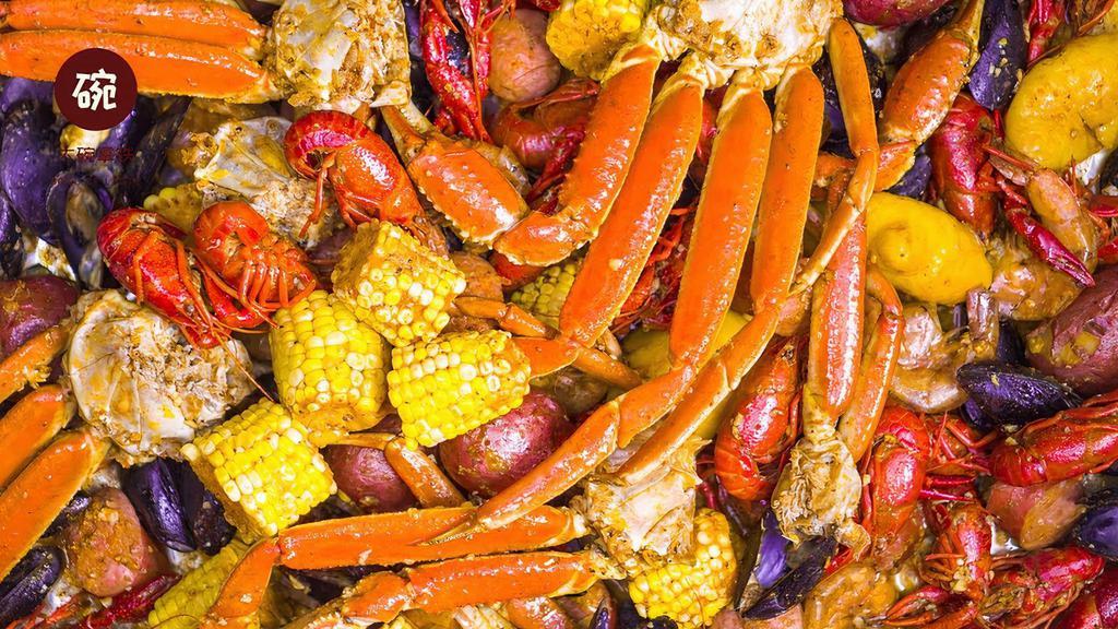 Seafood Combo D · For 4 to 5 person. Include 2 pieces lobster tail, 2 lbs snow crab, 2 lbs gulf shrimp, 1 lb mussel, and 1 lb clam. Served with egg, corn, potato, and sausage. No substitution, additional item will be charged at regular price.