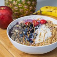 The Amazing Acai Bowl · Acai, pomegranate & blueberries with yogurt, topped with granola, almond butter, banana, chi...
