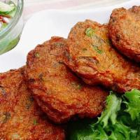 Fish Cake · Fishcakes are chopped or minced fish mixed with potato, egg and flour with seasonings of oni...