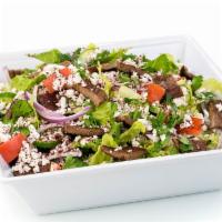 Gyro Salad · Gyro, lettuce, tomatoes, onions, cucumbers, parsley, sumag, Greek Feta cheese.