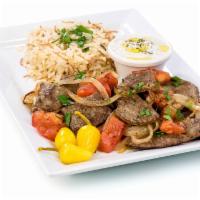 Gyro Plate · Traditional Greek gyro meat mixed with grilled onions and tomatoes.