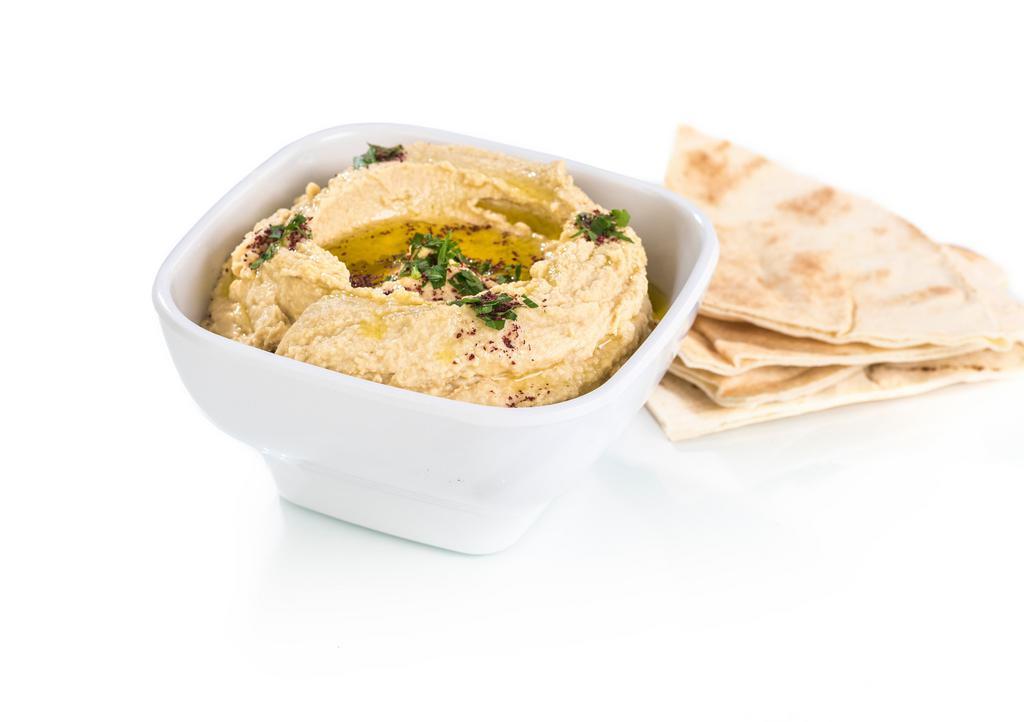 Hummus · Vegetarian. Our homemade blend of garbanzo beans and spices.