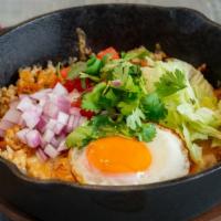 Japanese Beef Taco Rice · Curry fried rice, burnt cheese, sunny side up egg.