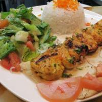 Chicken Tawook · Served with rice and salad.