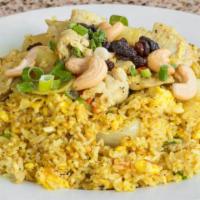 R3 Thai Pineapple Fried Rice · Stir-fried jasmine rice with egg, curry powder, cashew nuts, raisins, pineapple and onions.