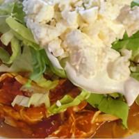 Tostadas · Topped with beans meat of choice, lettuce, tomato, sour cream, white powder cheese.