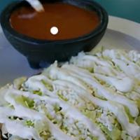 Huarache · Masa dough with smashed beans, mozzarella cheese, with your choice of meat, lettuce, sour cr...