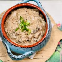  Beef Stroganoff · Sauteed beef with mushrooms and onions in a sour cream sauce, served with egg noodles, inclu...