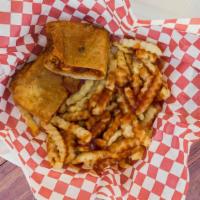 Tay'S Pizza Puffs · A pizza puff served with a side of fries, while topped with our favorite mild sauce.