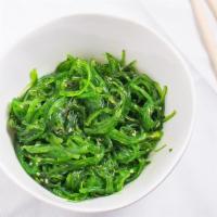 Seaweed Salad · Japanese seaweed salad topped with sesame seeds and oil.
