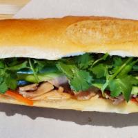 Grilled Chicken Banh Mi · Grilled lemongrass chicken, house mayo, pickled carrots, cucumber, jalapeño pepper, and cila...