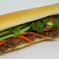 Grilled Beef Banh Mi · Grilled marinated beef, house mayo, pickled carrots, cucumber, jalapeño pepper, and cilantro.