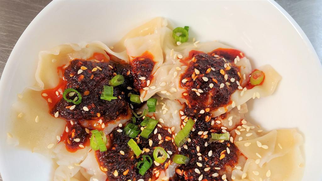 Chili Oil Wontons · House-made seven pork dumplings drizzle with house-made chili oil. This dish does has a bit of a kick to it, but not too spicy.