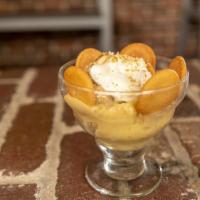 Banana Pudding Slice · Layers of sweet vanilla custard, wafers, bananas, and whipped cream.
