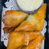 Esfenaj Pie (Vg) (پای اسفناج) · Crispy layers, filled with spinach and feta cheese. Served with cucumber wasabi dipping sauce.