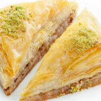 2 Triangle Baklava · Layers of fill dough, chopped walnuts, almonds, syrup and honey