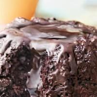 Mini Chocolate Lava Cake · Decadent moist dark chocolate cake enrobed with dark chocolate filled with a dark chocolate ...