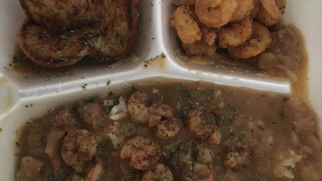 Nola Plate · Etouffee layered over white rice. Grilled shrimp and garlic bread