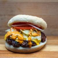 Kofta Burger · Halal kofta burger on hamburger bun.