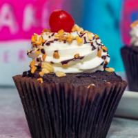 Hot Fudge Sundae · a chocolate cake with a chocolate filling, topped with our signature buttercream frosting, s...