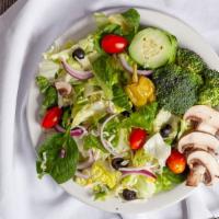 Garden Salad · Fresh, mixed green salad with mushrooms, tomatoes, cucumbers, carrots, and garlic Parmesan c...