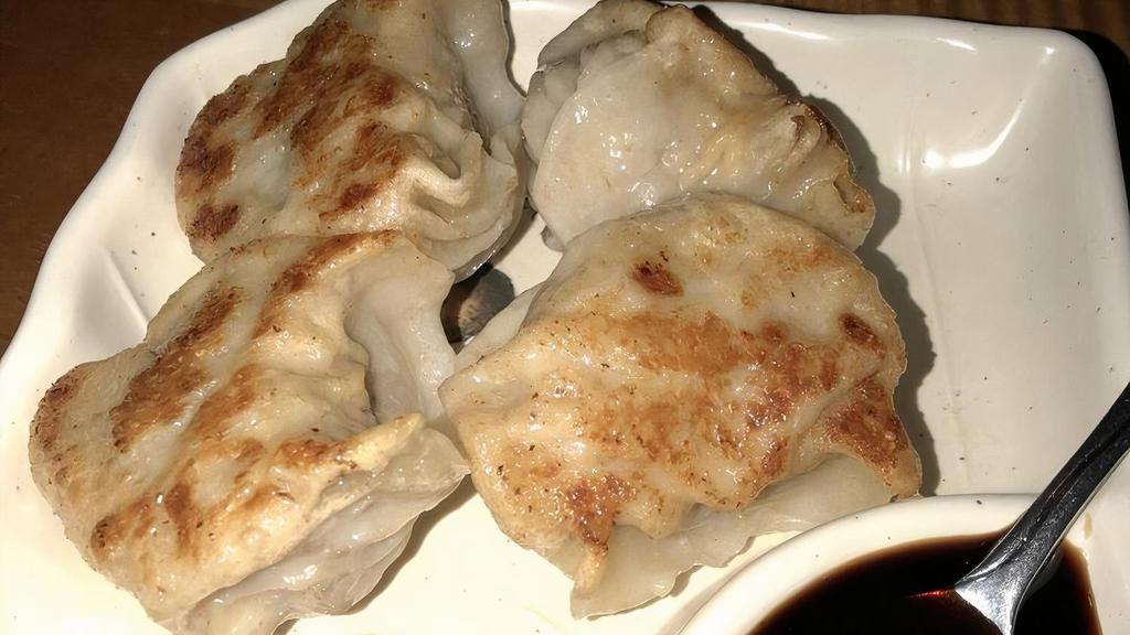 Pork Dumplings · Four pieces. Steamed or pan-fried.