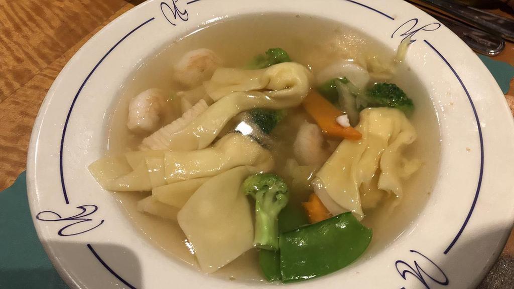 Penang Wonton Soup · Wonton filled with chicken, shrimp, scallops and seasonal greens in chicken broth.