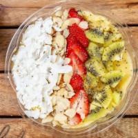 Turmerical Bowl · Topped with kiwi, strawberries, almonds, coconut.