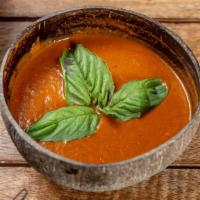 Tomato Soup · Zesty and creamy tomato soup with our house made veggie broth slow cooked tomatoes, house sp...