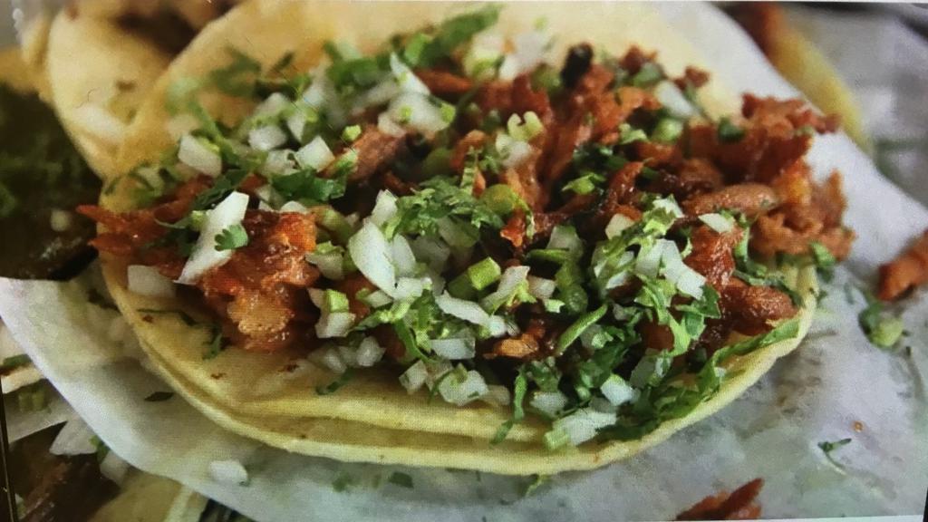 Pastor Tacos · Three marinated pork tacos over corn tortilla.Served with a side of black beans, cilantro/onions and salsa.