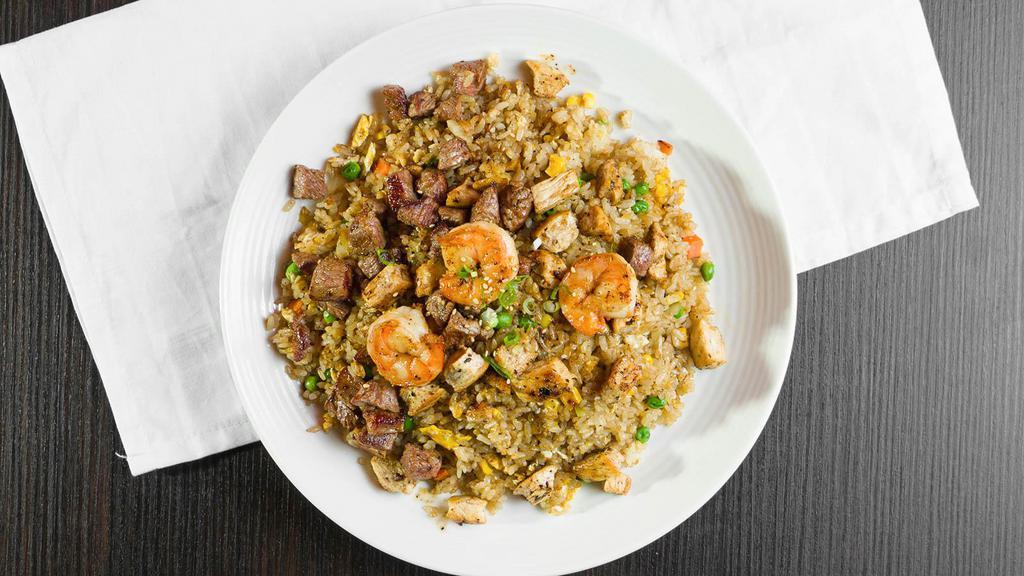 House Combination Fried Rice · Combination of ny steak, chicken and shrimp.