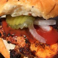 Smoked Chicken Sandwich · On a fresh baked brioche bun. Comes with homemade bbq sauce,onions,pickles,and jalapenos on ...
