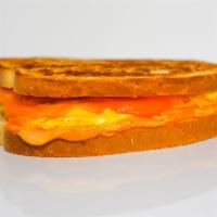 Egg & Three Grilled Cheese Melt · Lightly scrambled egg, Cheddar, Swiss, and Parmesan cheeses melted between buttery, toasted ...