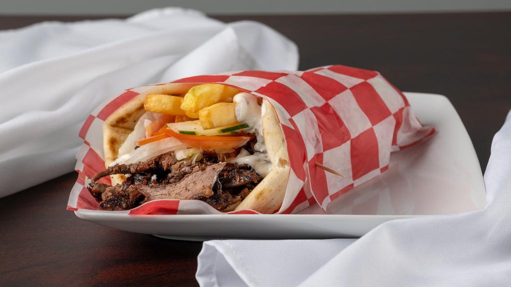 Lamb Gyro · With tzatziki, onion, tomato and French fries on a pita. Add fries for an upcharge.