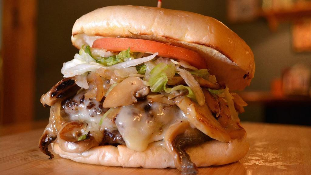 Mushroom Swiss Burger · comes with 1 burger patty on a white bun with Swiss cheese, grilled onions and mushrooms, lettuce, and tomato